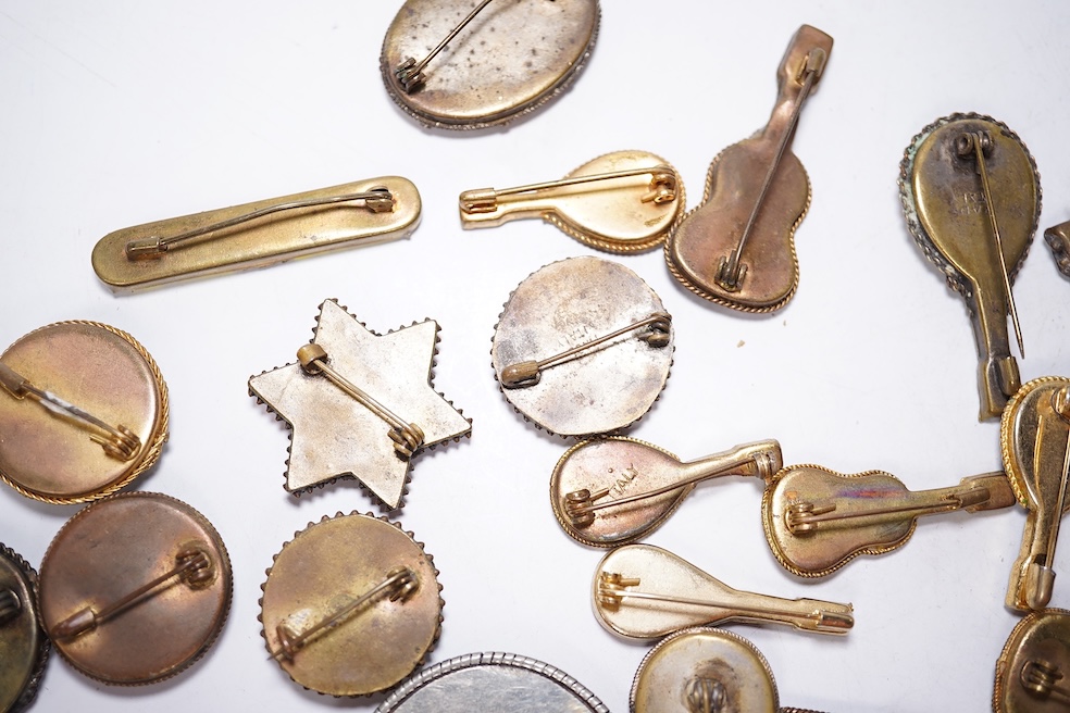 A collection of thirty-one micro-mosaic brooches, including fourteen mixed guitar and banjo shaped brooches, six large oval brooches and seven smaller brooches, three long brooches and a star shaped brooch. Condition - g